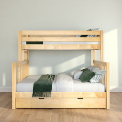 Light wood bunk bed with under-bed storage drawer, white mattress, green throw and patterned pillows in sunlit minimalist bedroom
