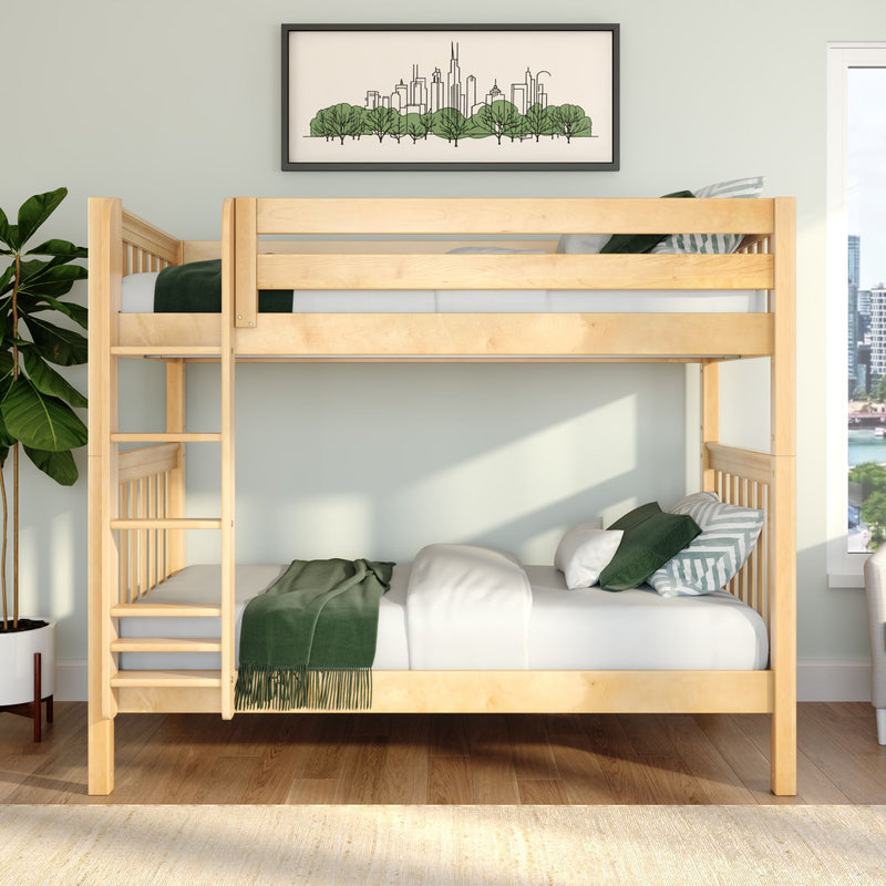 Natural wood bunk bed in a modern kids' bedroom with green bedding and pillows, potted plant, hardwood floors and framed city skyline wall art