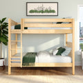 Natural wood bunk bed in a modern kids' bedroom with green bedding and pillows, potted plant, hardwood floors and framed city skyline wall art