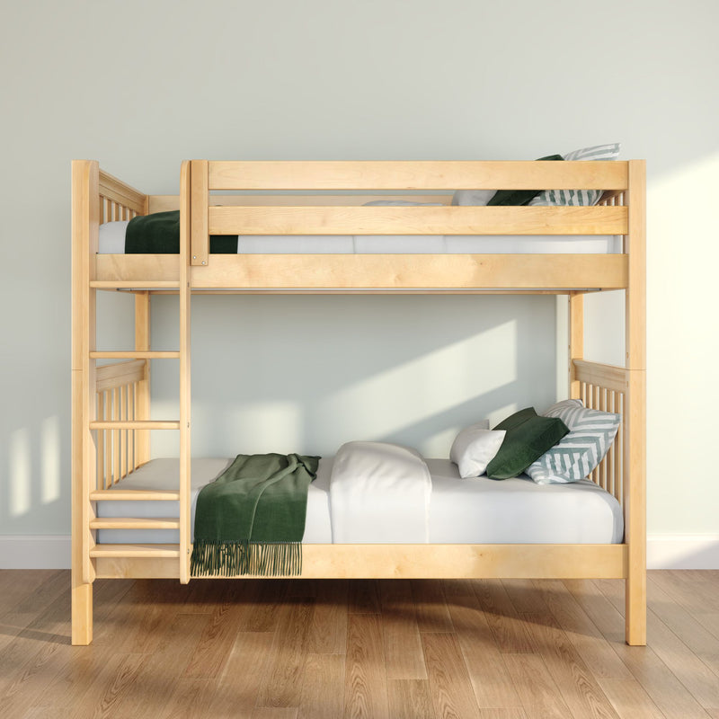 Natural wood twin-over-twin bunk bed with ladder, green blanket and striped pillows in bright minimalist children's bedroom