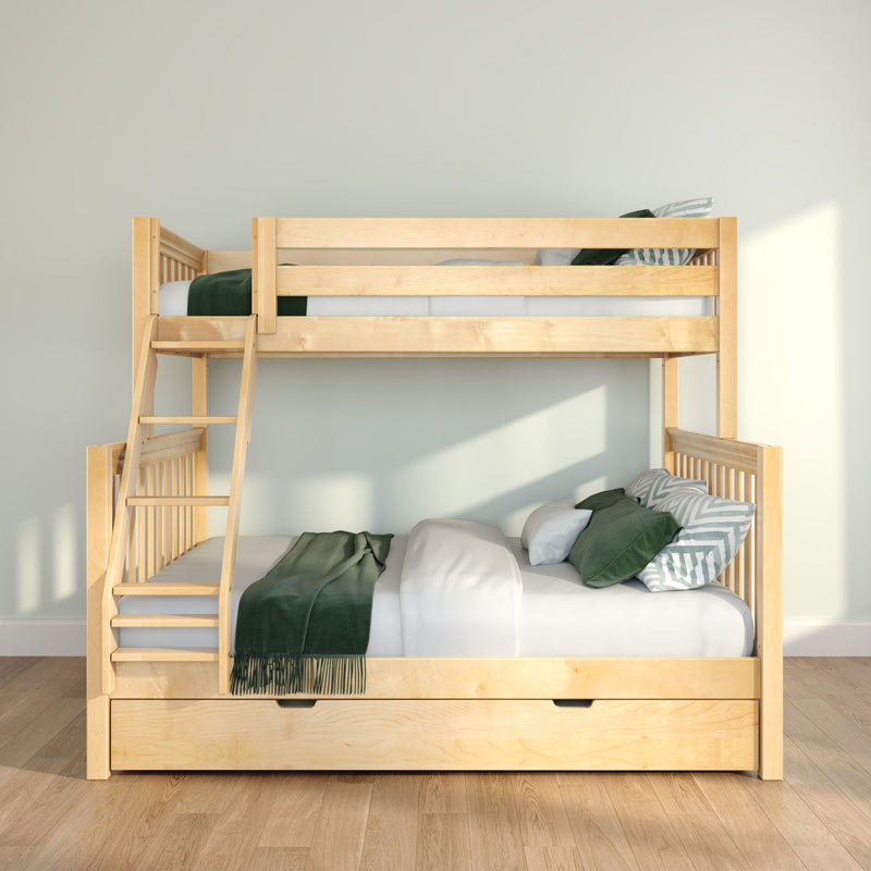 Light wood bunk bed with ladder and under-bed storage trundle, styled with green throw blanket and striped pillows in a bright minimalist kids' bedroom
