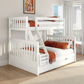White wooden bunk bed with ladder and under-bed drawers, orange linens and pillows in a modern bright kids' bedroom with city skyline view