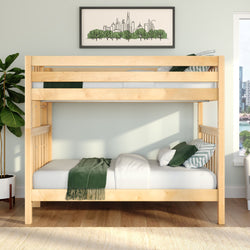 Natural wood bunk bed in a sunlit modern bedroom with white bedding, green throw and striped pillows, framed city skyline art and a fiddle leaf fig plant