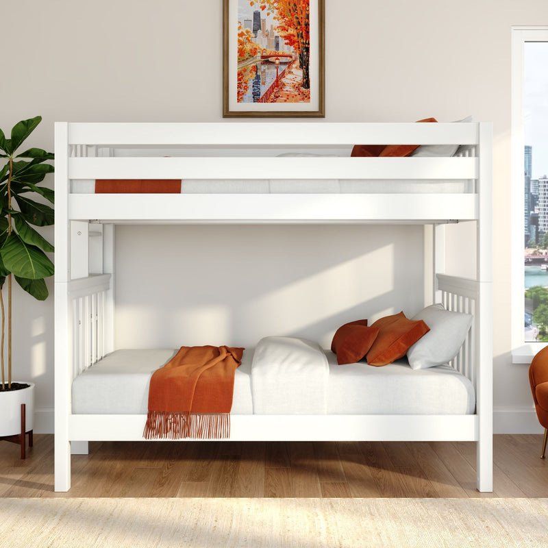 White wooden twin bunk bed with orange throw and pillows in a modern kids' bedroom with hardwood floors, potted plant and framed autumn city print