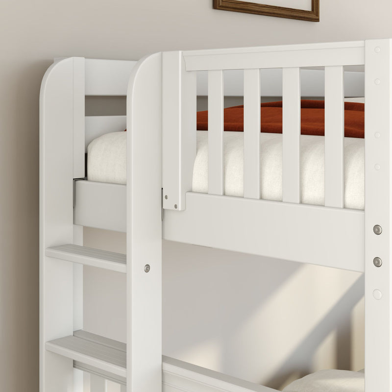 Close-up of white wooden bunk bed ladder and safety rails with neutral bedding and rust blanket in modern kids' bedroom