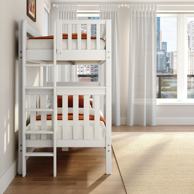 White wooden bunk bed with ladder and orange bedding in a bright modern kids' bedroom with sheer curtains, hardwood floors and city skyline view