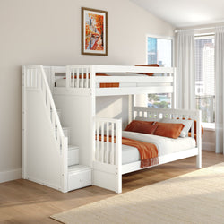 Modern kids bedroom with white bunk bed and built-in storage stairs, orange bedding, framed autumn art and city-view windows