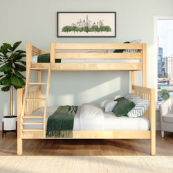 Natural wood bunk bed in modern kids' bedroom with green bedding, leafy potted plant and framed city skyline art