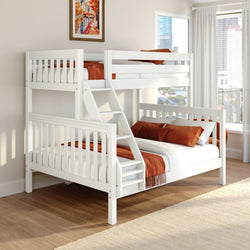 White wooden twin-over-full bunk bed with ladder and safety rails, orange bedding and pillows in a modern kids' bedroom with hardwood floors and a city-view window