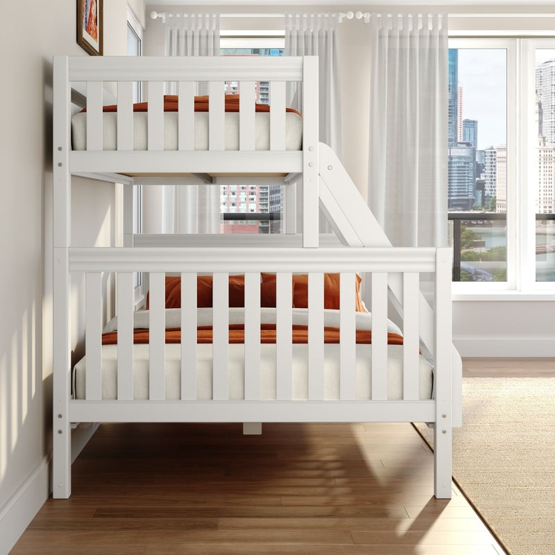 White wooden bunk bed with orange bedding in a bright modern kids bedroom by floor-to-ceiling windows and sheer curtains city view