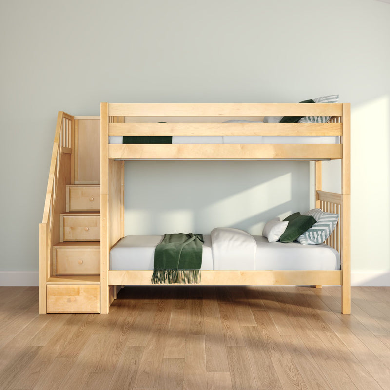 Natural wood bunk bed with built-in storage staircase, green bedding and pillows in a bright modern kids' bedroom on hardwood floors