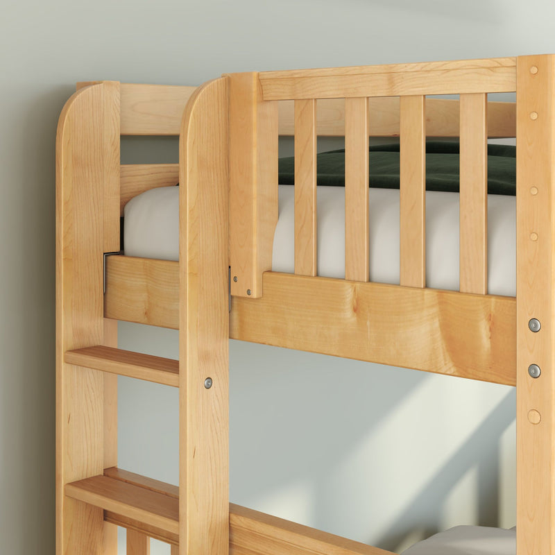 Close-up of a light solid wood bunk bed showing ladder steps and a slatted guardrail in a child's bedroom