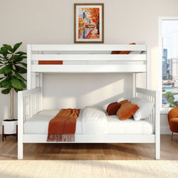 Modern white loft bunk bed in a bright kids' bedroom with orange throw and pillows, framed autumn cityscape wall art, fiddle‑leaf fig plant and city skyline view