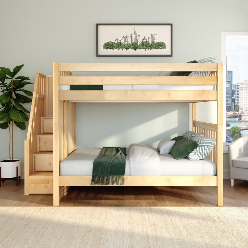 Natural wood loft bunk bed with staircase drawers and green bedding in a modern kids' bedroom with framed city skyline art