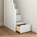 White wooden staircase with built-in under-stair storage drawers, space-saving design with open drawer revealing folded clothes on hardwood floor