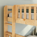 Close-up of solid maple wood bunk bed ladder and safety rail with green bedding and neutral wall in modern kids bedroom