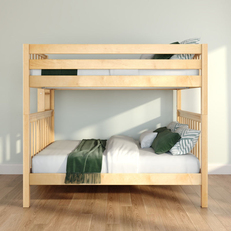 Light wood bunk bed with green bedding and pillows in a modern minimalist bedroom with natural light on hardwood floors