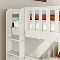 Close-up of white wooden bunk bed ladder and slatted guardrail with beige mattress and rust-orange blanket in a modern children's bedroom