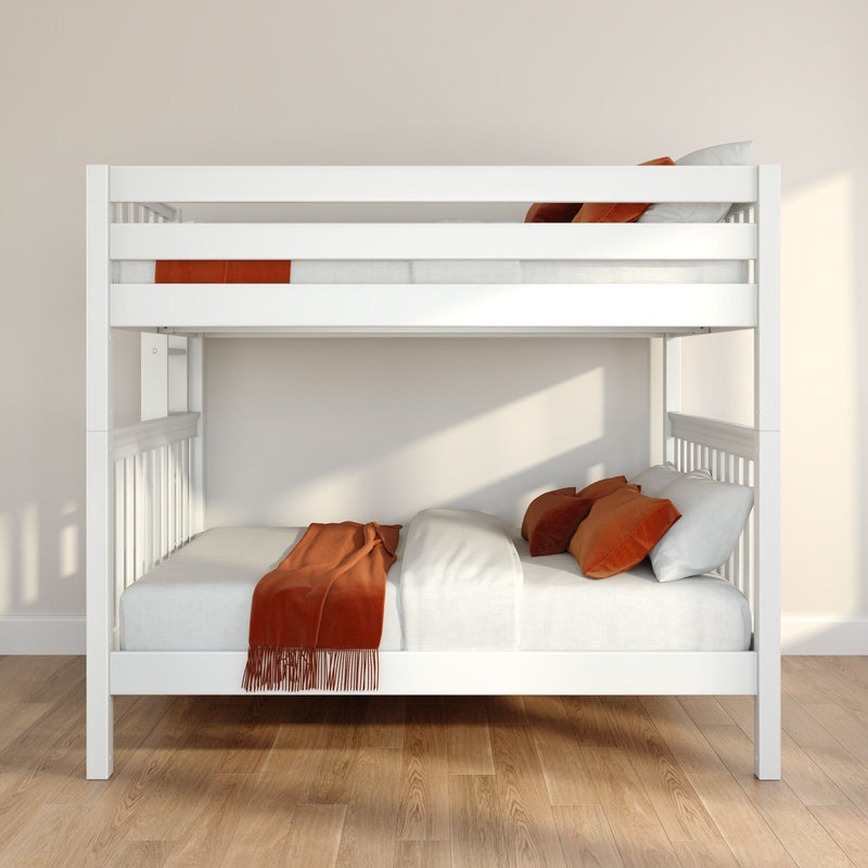 White wooden bunk bed with lower full-size mattress, rust-orange throw and pillows on light wood floor in modern minimalist kids' bedroom