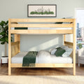Loft-style natural wood bunk bed with green throw and patterned pillows in a modern bedroom with potted plant and framed city skyline art