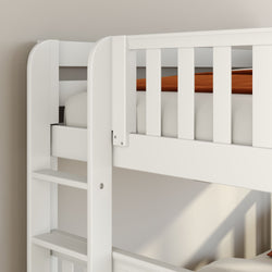 Close-up of a white wooden bunk bed ladder and safety rail with rust-orange blanket, modern kids bedroom furniture detail and slatted bed frame against a beige wall