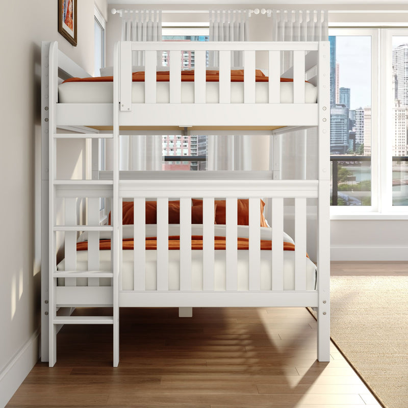 White wooden twin bunk bed with ladder and orange bedding in a bright modern bedroom with hardwood floors and a city skyline view through large windows
