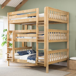 Solid wood triple bunk bed with ladder and twin mattresses in light natural finish, styled in a space-saving kids' bedroom with green wall and blue linens