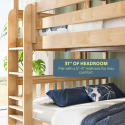 Light wood twin-over-full bunk bed with ladder and 31 inches of headroom, blue pillows and quilt, space-saving bedroom furniture