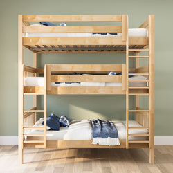 Solid maple triple bunk bed with ladders and three twin mattresses, blue bedding in a space-saving kids' bedroom