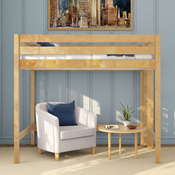 Small-space wooden loft bed reading nook with light wood loft bed over a cozy gray upholstered armchair, navy pillow, round wooden side table, potted plant, blue paneled wall and framed cityscape artwork
