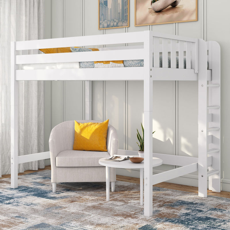 White wooden loft bed with ladder over cozy reading nook — beige armchair with yellow accent pillow, round white coffee table, potted plant, gray paneled wall and patterned area rug; space-saving bedroom furniture