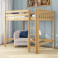 Natural wood twin loft bed with ladder over seating and study nook, gray armchair with navy pillow in light-blue paneled bedroom