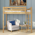Natural wood loft bed with ladder over cozy armchair and round side table against blue paneled wall — modern small-space bedroom furniture