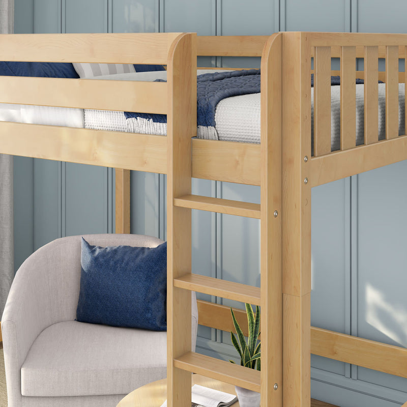 Light wood loft bed with built-in ladder, navy and white bedding, cozy armchair with blue pillow and potted plant against pale blue paneled wall — space-saving modern kids' bedroom setup