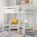 White wooden twin loft bed with ladder and guardrails over a cozy reading nook featuring a beige armchair, yellow accent pillow, round side table and plant — space-saving kids' bedroom furniture in a modern room with area rug and wall art