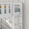 Close-up of white wooden bunk bed ladder and safety rails with blue leaf-patterned mattress and mustard throw in a modern kids' bedroom