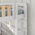 White wooden bunk bed ladder and guardrail with blue leaf-patterned bedding and mustard throw in a modern kids bedroom