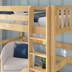 Natural wood loft bed with built-in ladder, twin mattress and navy quilt over a cozy reading nook with beige armchair, navy pillow and potted plant against a light blue paneled wall