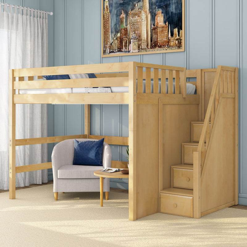 Light maple loft bed with built-in staircase drawers and under-bed seating area, modern kids bedroom with blue paneled wall, armchair and round table