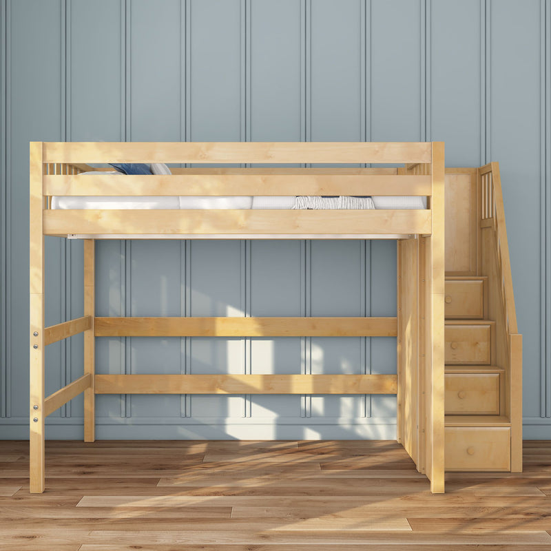 Natural wood loft bed with built-in staircase and three storage drawers against blue paneled wall on hardwood floor