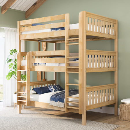 Three-tier solid wood bunk bed with ladders and blue bedding in a bright, space-saving kids' bedroom