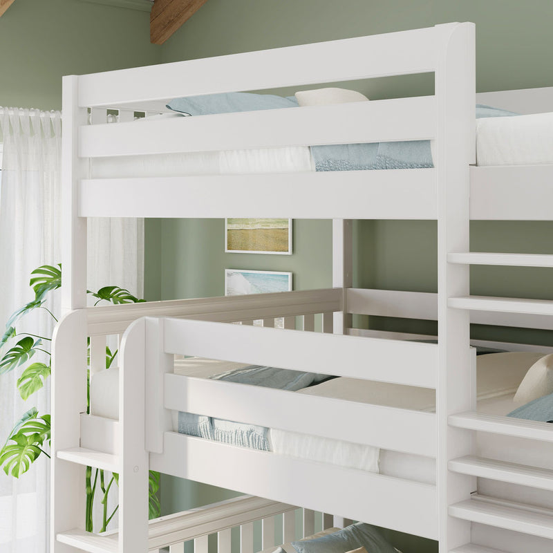 White wooden triple bunk bed with ladder in modern kids bedroom, light blue bedding, green accent wall and potted plant