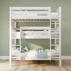 White three-tier wooden bunk bed with light blue and white bedding against a sage green wall on light wood flooring