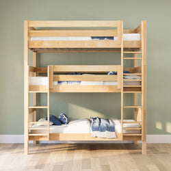 Light maple triple bunk bed with ladders, white mattresses and blue throws in a space-saving kids bedroom with sage green wall