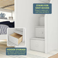 Loft bed with built-in stairs and drawers for easy access and hidden storage solutions.