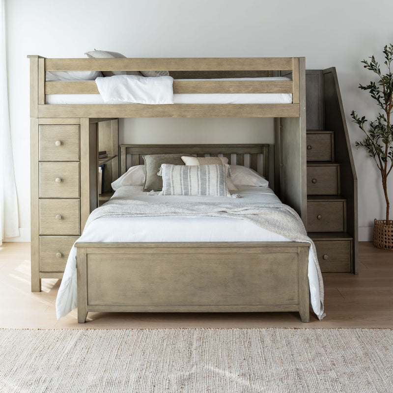 Modern wooden bunk bed with built-in storage drawers and staircase, perfect for maximizing space in a bedroom.