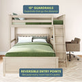 Loft bed with 15-inch guardrails and reversible entry points, featuring a wooden ladder and comfortable chair.