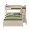 Twin over full bunk bed with light wood finish and green bedding, featuring integrated ladder for modern bedroom furniture design.