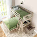 Loft bed with green bedding and built-in desk in a bright bedroom with natural light.