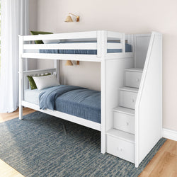 White wooden bunk bed with storage stairs and blue bedding in a modern bedroom setting.